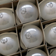 Boxes of incandescent light bulbs piled on top of each other.